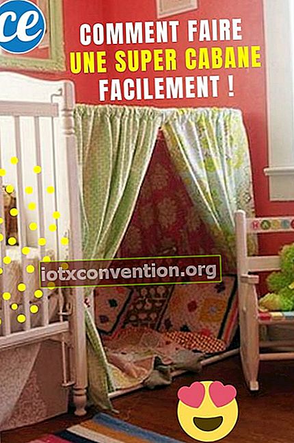 Una cabina realizzata con un lenzuolo e tessuti nella stanza di una bambina
