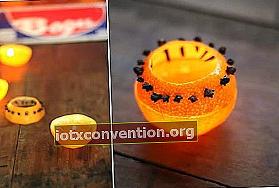 ett DIY myggavvisande ljus gjort med kryddnejlika och en apelsin