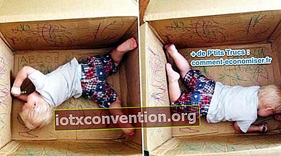 un bambino piccolo colore all'interno di una scatola di cartone