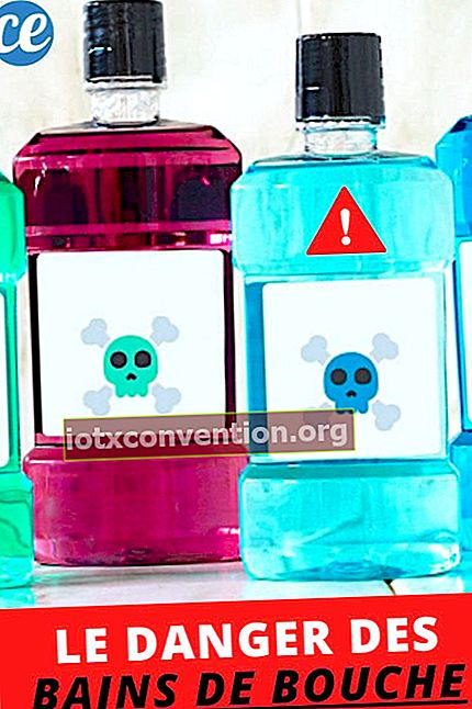Diverse bottiglie di collutori blu, rosa, verdi che sono pericolosi per la salute